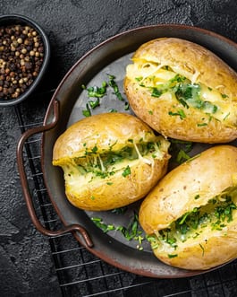 Jacket potatoes with Confit Garlic and Zhug butter